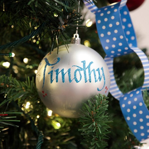 Silver Shatterproof Christmas Bauble Hanging in a Christmas Tree