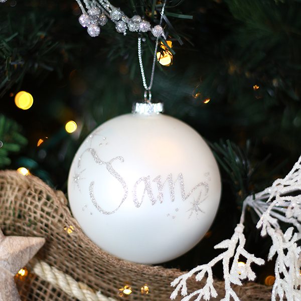 Hamptons Personalised Christmas Bauble named Sam Hanging in a Christmas Tree