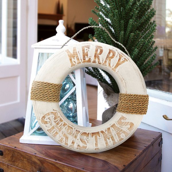 Merry Christmas Life Buoy Beach Wreath Beside a Lantern with flameless Candle