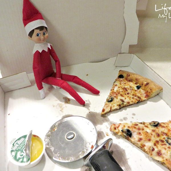 Elf in Pizza Box - Pizza Already sliced with Sauce beside