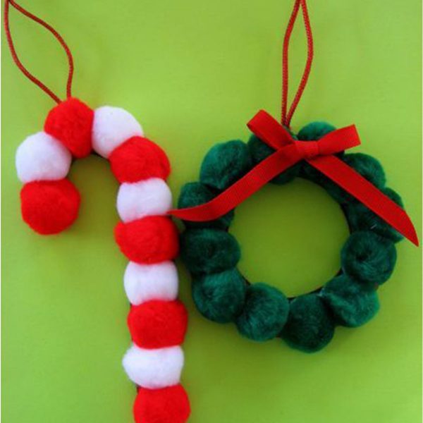 Candy Cane and Wreath Hanging Decor Pom Poms Placed in a green Background