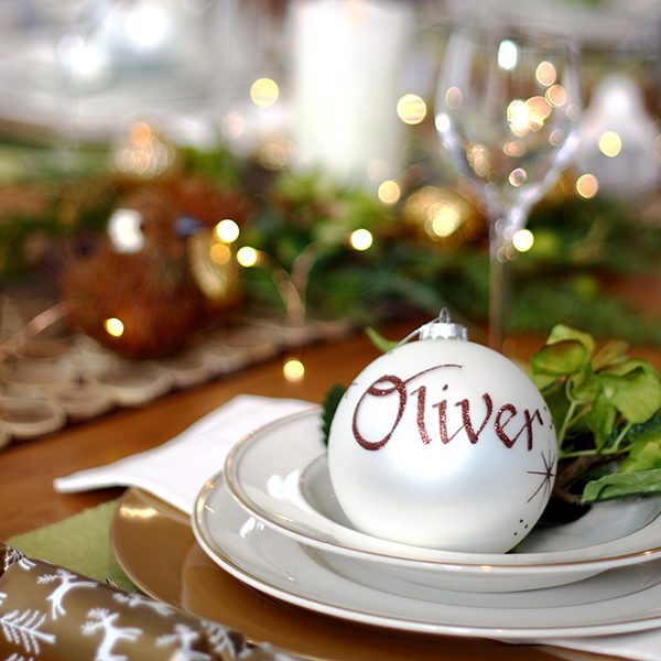 Christmas White Personalised Bauble named Oliver placed in a Plate