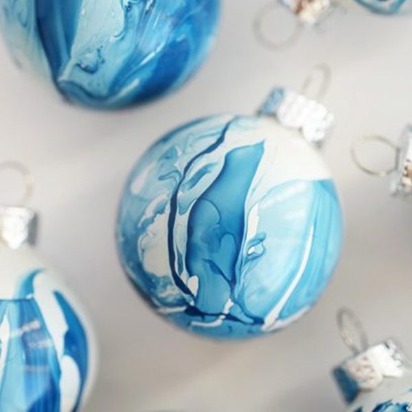 Painted Blue Bauble Placed in a White Surface