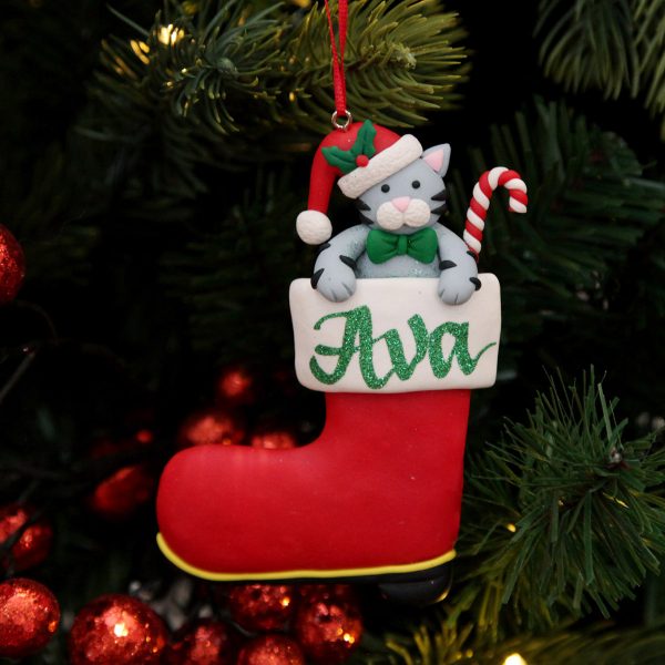 Cat in Santa Boot Personalised Christmas Tree Decoration Named Ava Hanging in A Christmas Tree