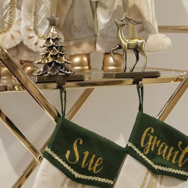 Christmas Joy Console with Personalided Green and Gold Mistletoe Christmas Stocking and Ivory and Gold Standning Santa Christmas Ornaments