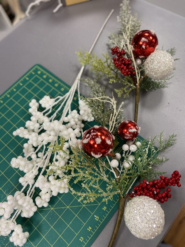 Mixed Christmas Garland with Snowy and Red Berry Placed in a flat surface