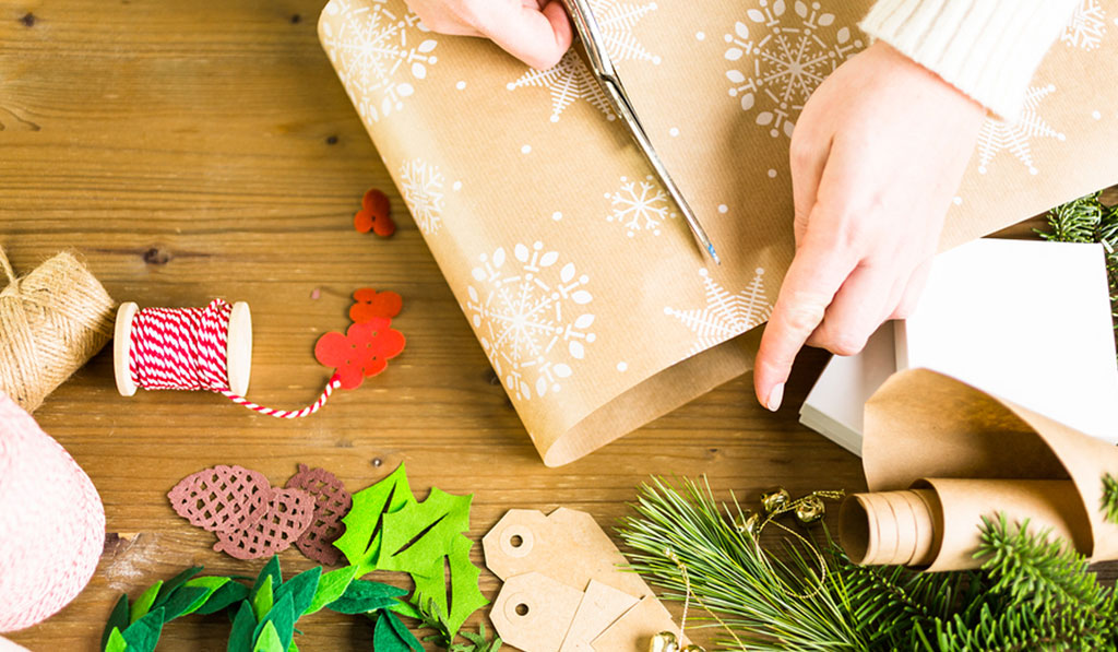Bigstock Gift Wrapping and a person cutting with scissors Featured Image