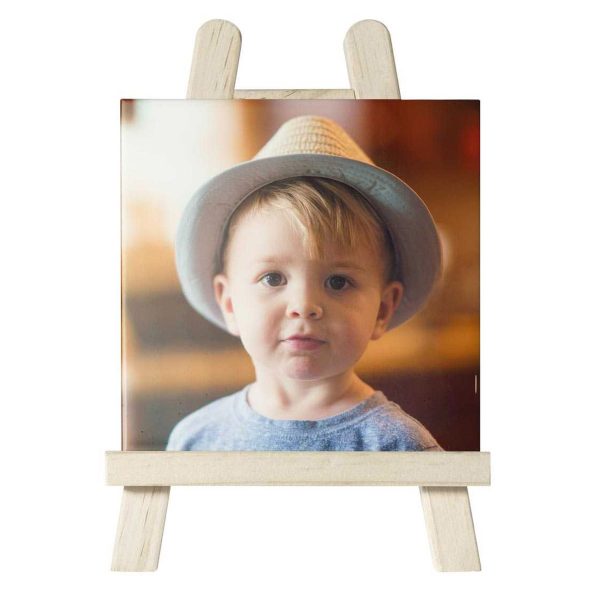 Ceramic tile Easel with a little boy as a front picture wearing a hat
