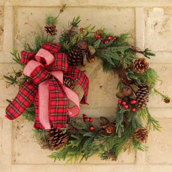 Bush Christmas Fir and Pinecone Wreath and Rustic Pine Christmas Floral hanging in the wall