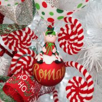 Candy Cane Christmas Red Boy Elf Christmas Character Bauble Hangs in A White Christmas Tree with candy cane design tree decor