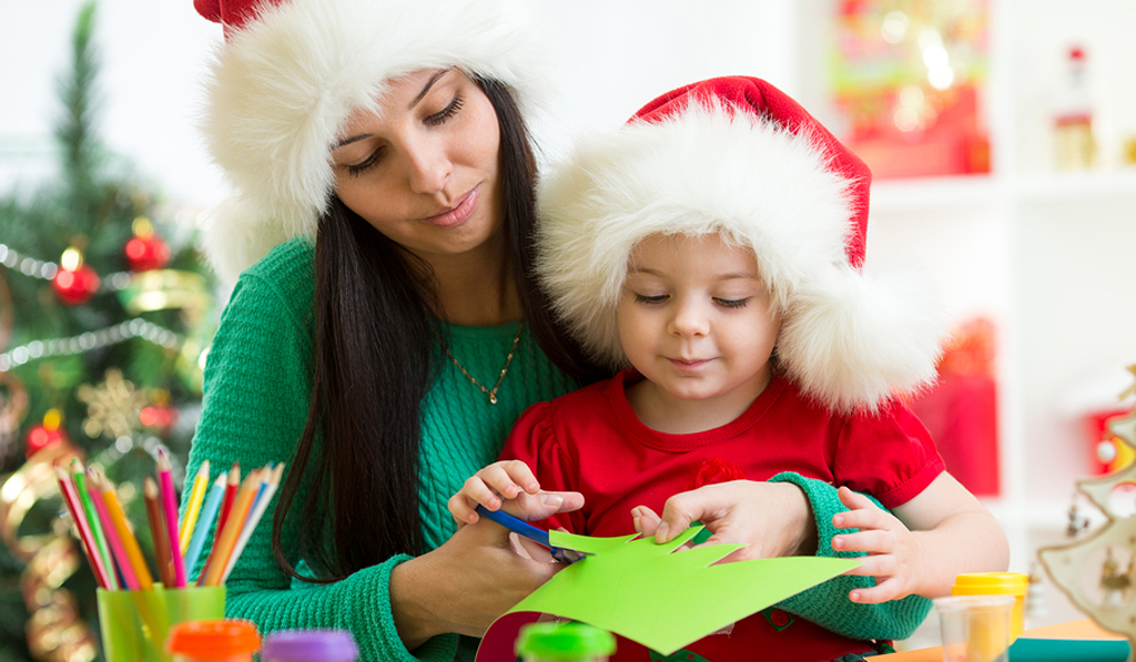 Bigstock Mother Child Cut Preparing Christmas Craft Coloured pencil beside them both of them wearing sant hat