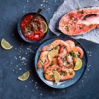 Shrimps and Salmon with Sauce beside and herbs