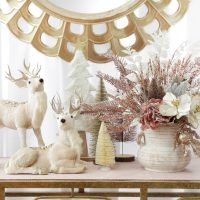 Boho Glam Christmas Console with Sitting Deer and a Standing Deer with Floral Base Beside