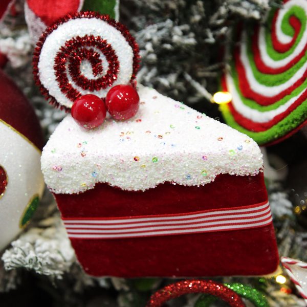 Peppermint Candy Christmas Red Velvet Cake Slice with Frosting and Sprinkles Decoration