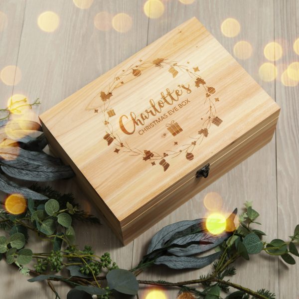 Wreath Wooden Christmas Eve Box placed in a wooden floor