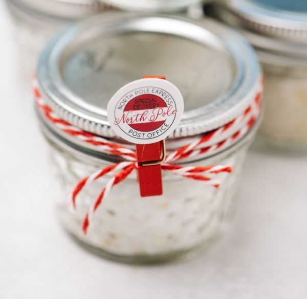 Infused salts placed in a Jar with red ribbon