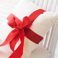 Ribbon wrapped in a cushion placed in a stoll