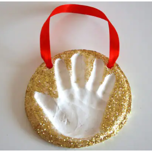 Hand print design with red ribbon handle placed in a white background surface