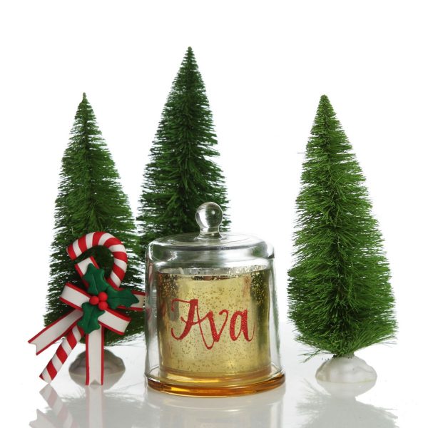 Personalised Gold Christmas Candle with Glass Cloche named Ava and table top tree beside