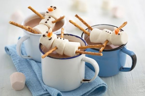 Hot Choco with snowman mallows placed in a cup of 3