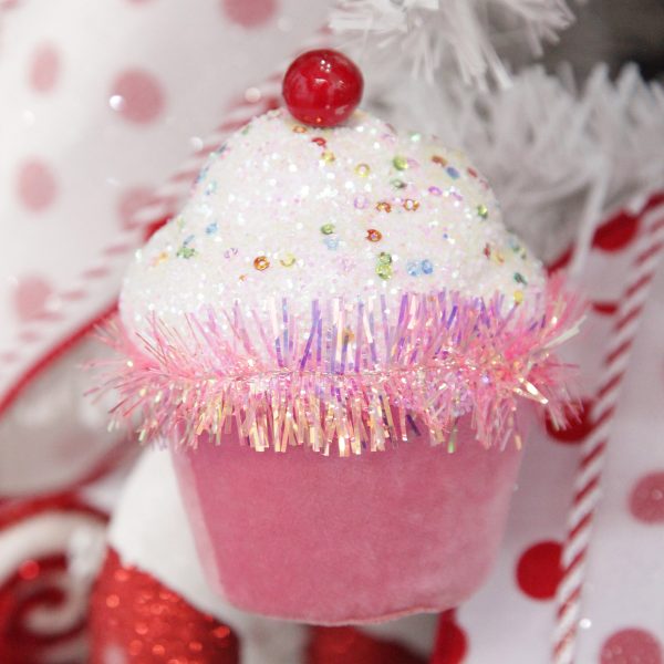 Sweet gingerbread christmas tree pink cupcake with frosting decoration