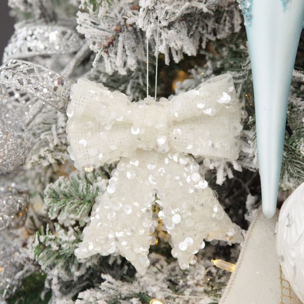Coastal Chic Christmas Tree White Glitter Sequin Bow Hnaging in a Christmas Tree