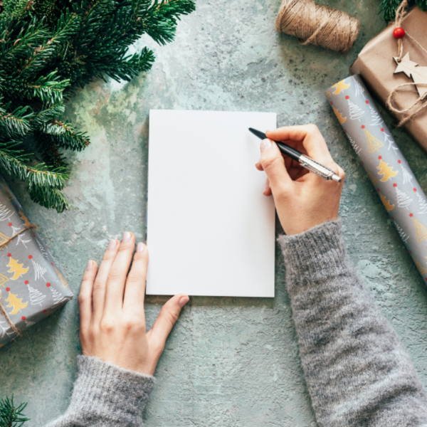 Christmas Checklists - Tring to write something on a blank notebook