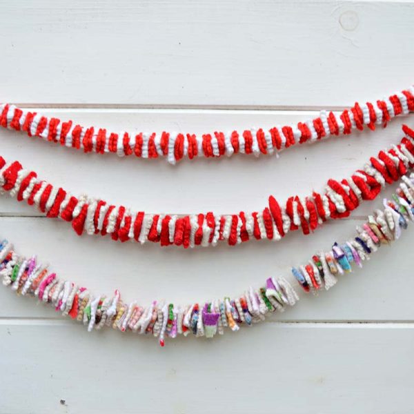Felt Tinsel Garland Hanging in A wooden Wall