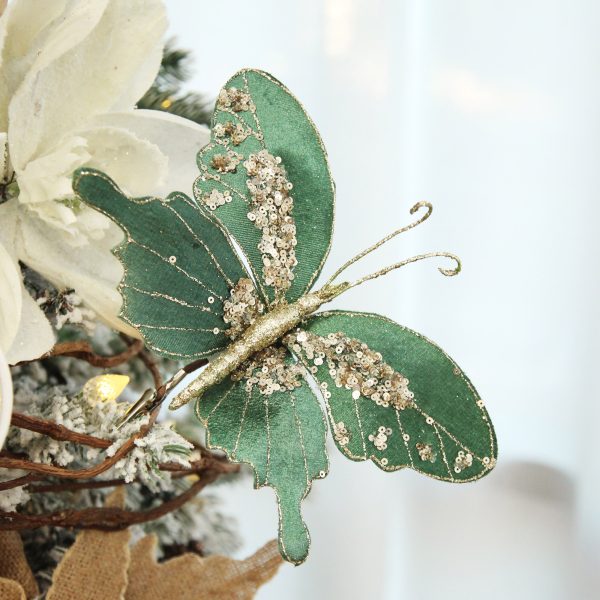 Green Velour and Glitter Butterfly Clip Placed in the Tip of the Christmas Tree
