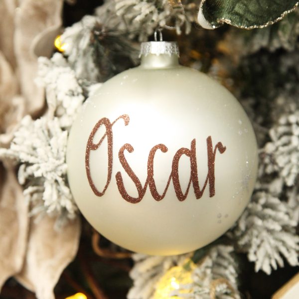Pearl Glass Personalised Christmas Bauble - Named Oscar Hanging in a Christmas Tree