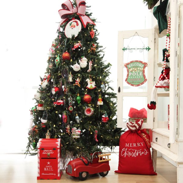 Vintage Christmas Tree Beside a red christmas sack
