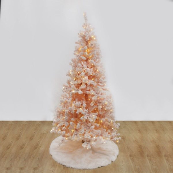Pre-lit snow floaked pink fir christmas tree lights on tree skirt