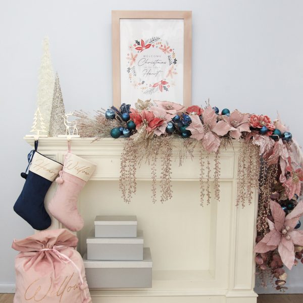 Blush and Blue Christmas mantle with Christmas stocking and a Christmas poster
