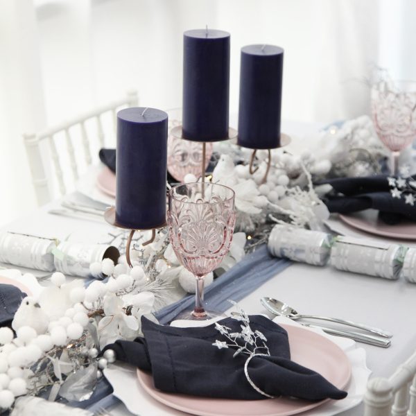 Blush and Blue Christmas Table with dark blue candle and silver bon bons