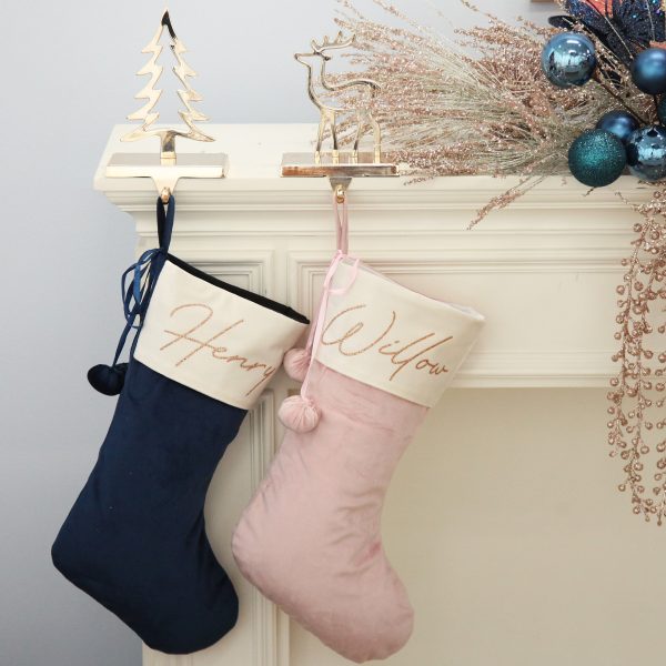 Blush and Blue Stockings hanging in a gold tree and deer Stocking hanger