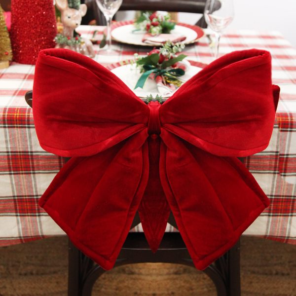Large Padded Red Velour Bow placed in a chair
