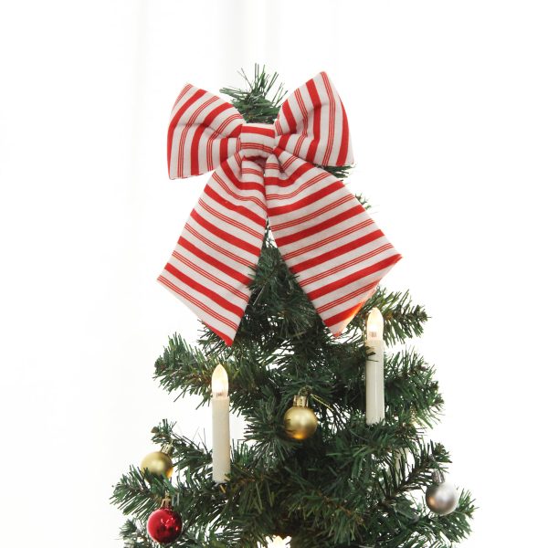Red and White Velvet Bow on top of a Christmas tree