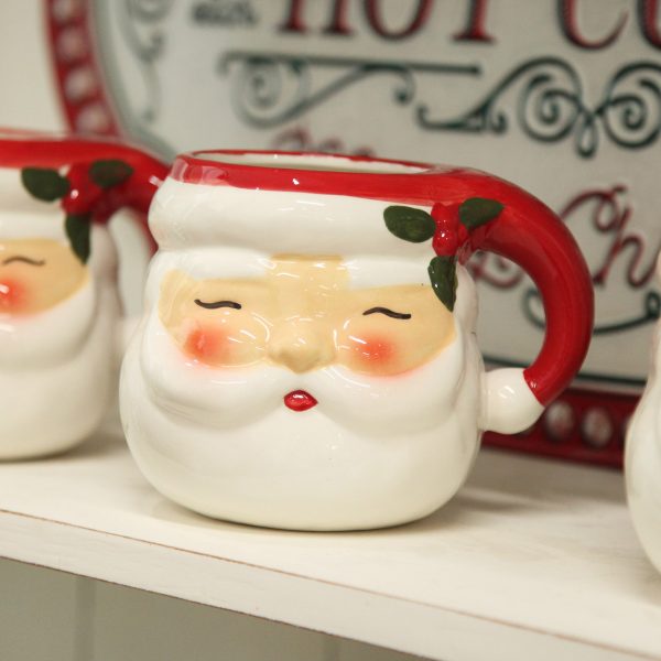Retro Santa Christmas Mug placed in a cabinet close up