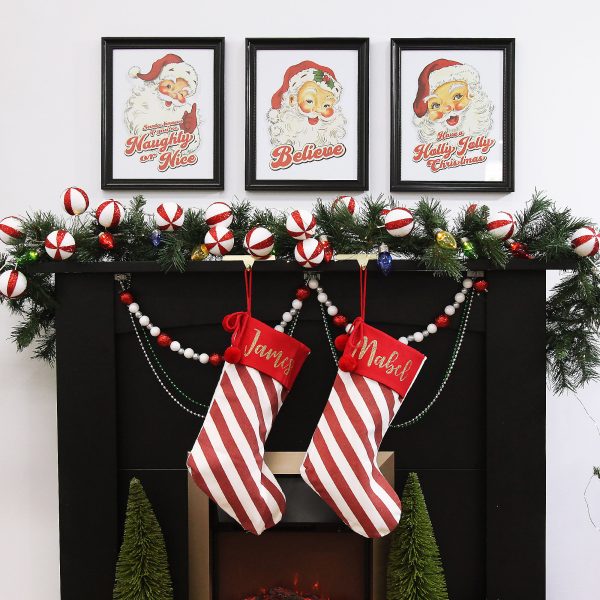Vintage Chrismtas mantle and personalised stockings hanging in a fire place