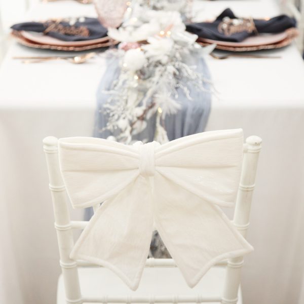 White Padded Velvet Bow placed in a chair