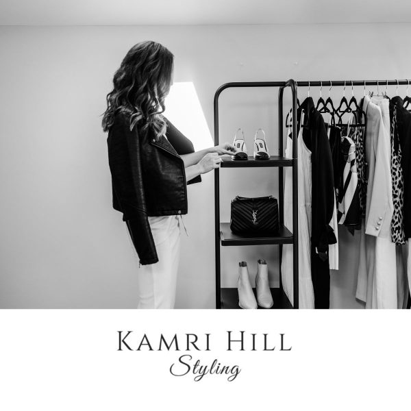 Sip Sparkle Style - Kamri Hill Styling -Woman standing in front of a clothes rack black & White