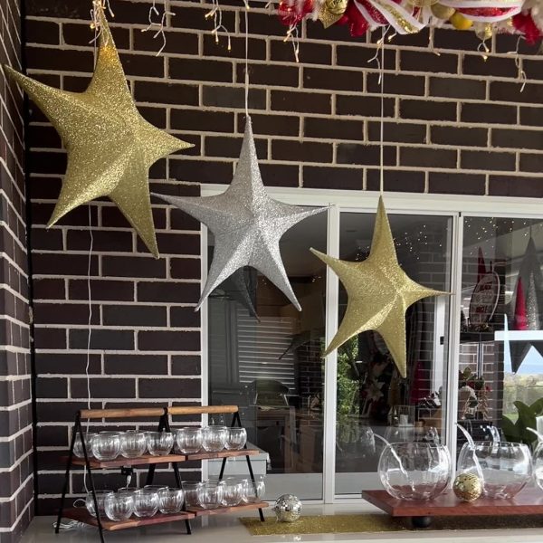 Cocktail Party with Silver and Golden Hanging Stars and a table with different Cocktails