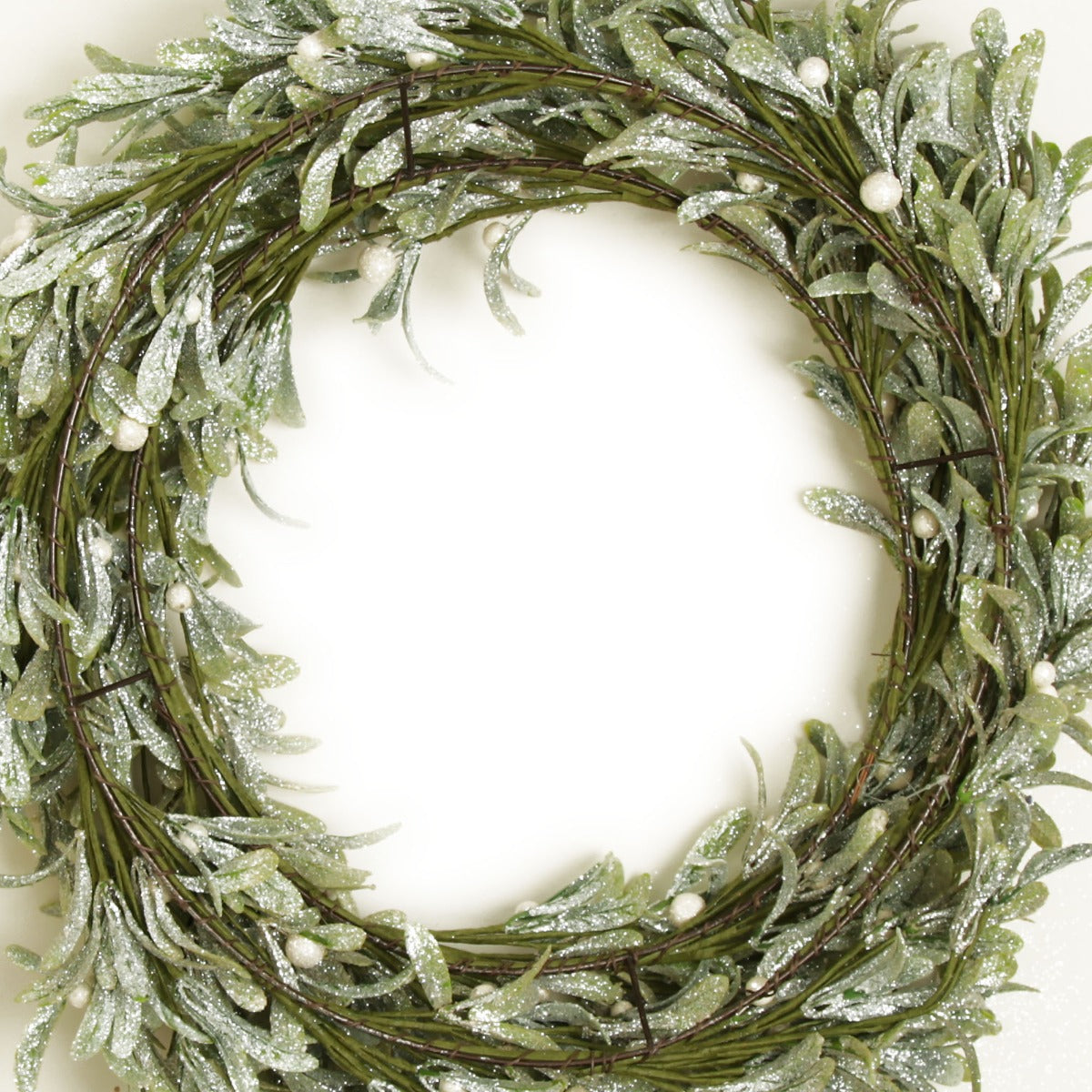 Frosted Green Leaf Christmas Wreath with White Berries Close up