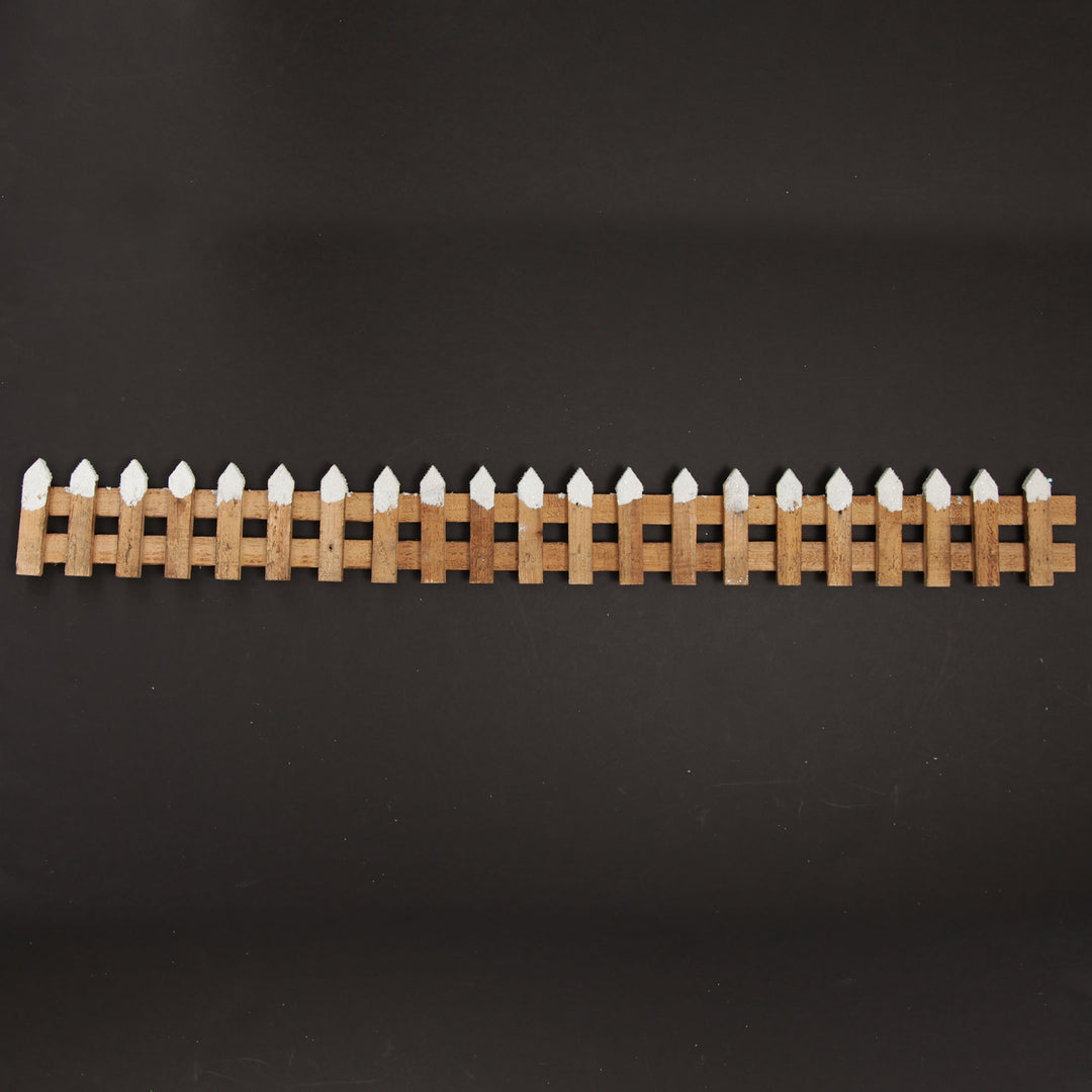 Short Snow Capped Natural Wooden Picket Fence