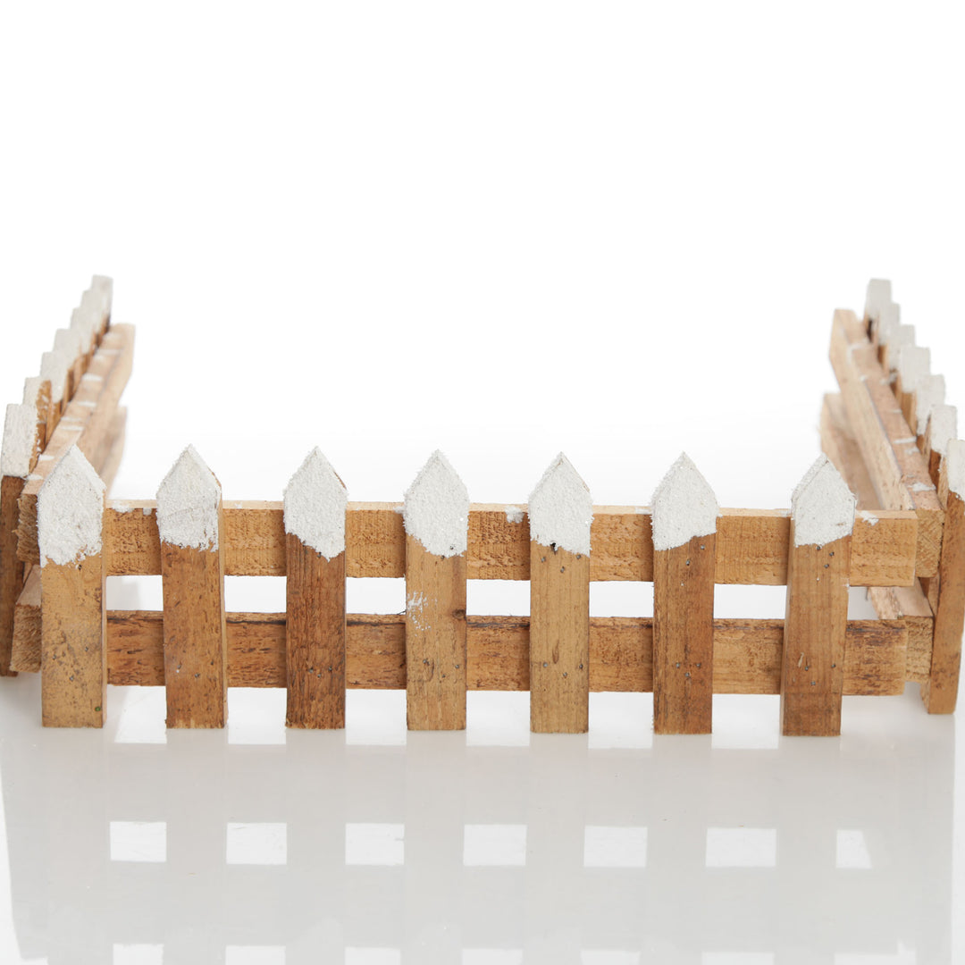 Short Snow Capped Natural Wooden Picket Fence