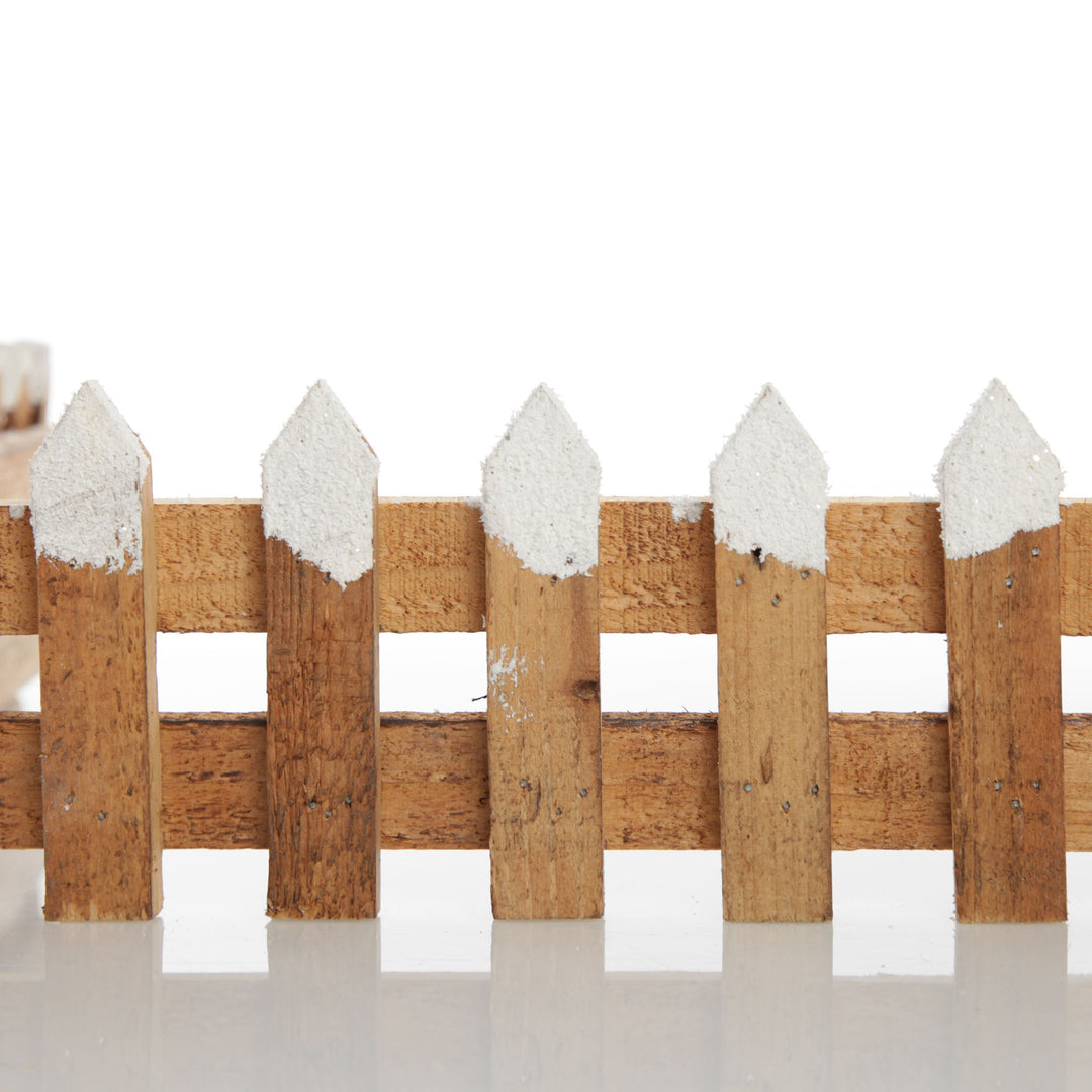 Short Snow Capped Natural Wooden Picket Fence