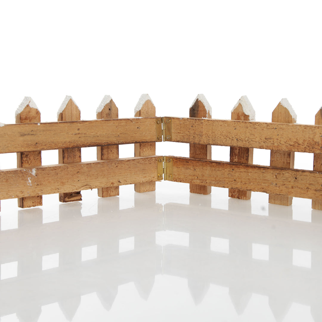 Short Snow Capped Natural Wooden Picket Fence