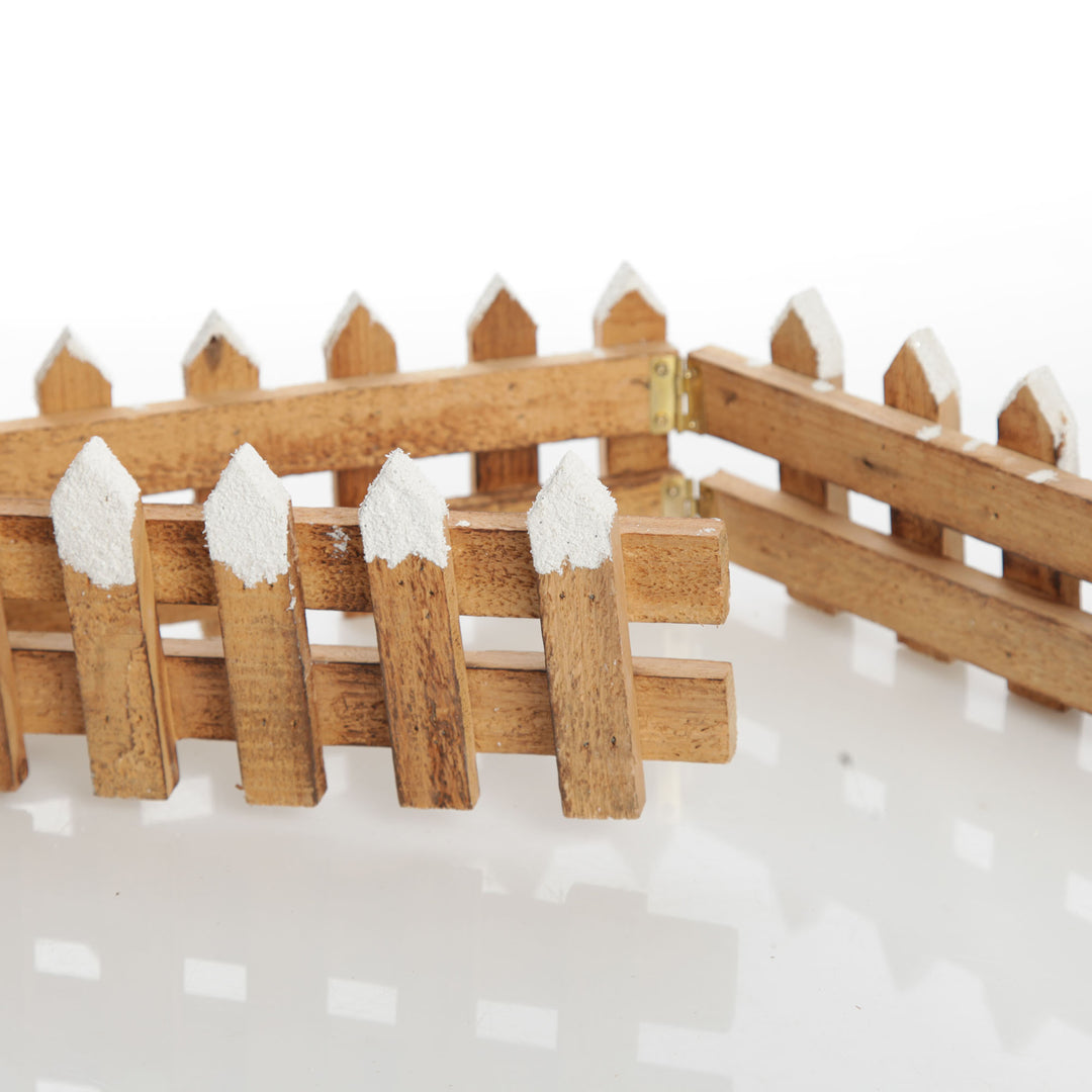 Short Snow Capped Natural Wooden Picket Fence