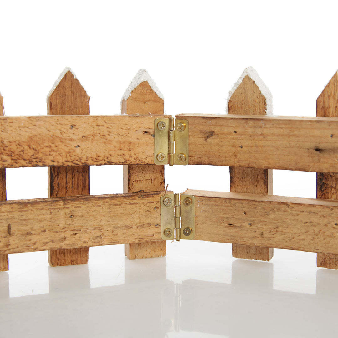 Short Snow Capped Natural Wooden Picket Fence