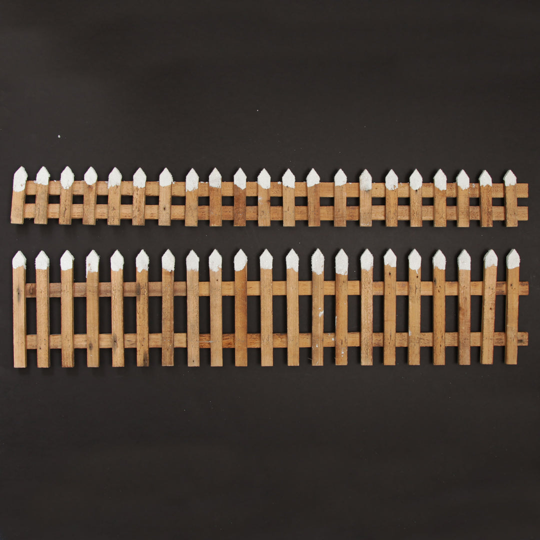 Short Snow Capped Natural Wooden Picket Fence